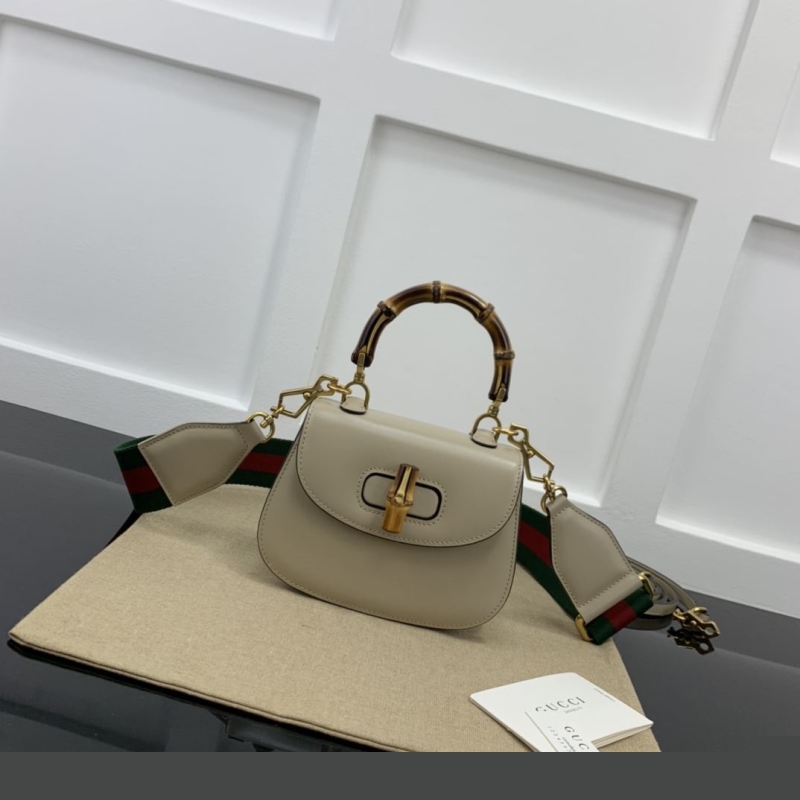 G*u*i top handle bags